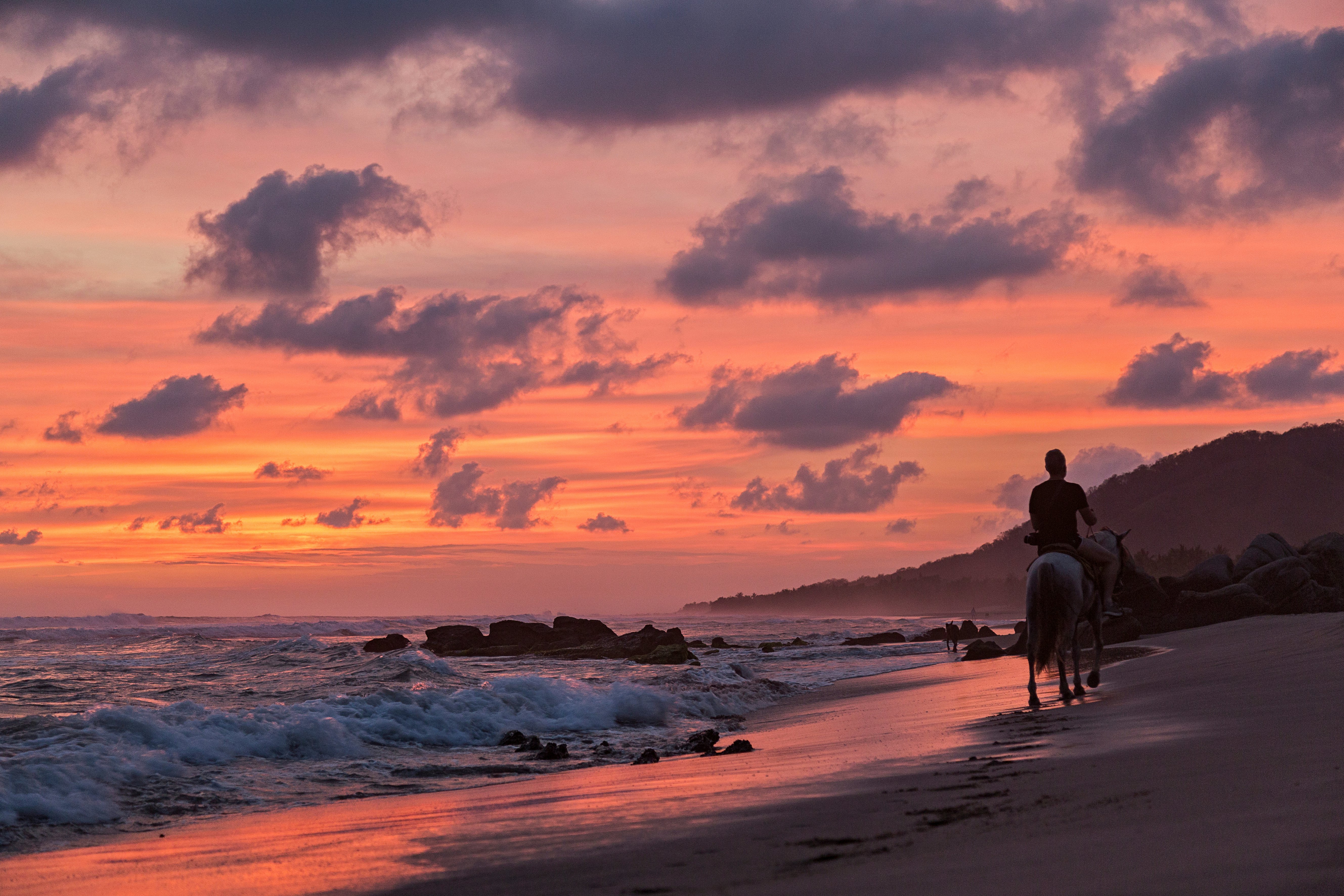 Man riding at sunset on the beach Troncones Guerrero Mexico License Type: media Download Time: 2023-05-19T08:17:31.000Z User: Is Editorial: No purchase_order:
