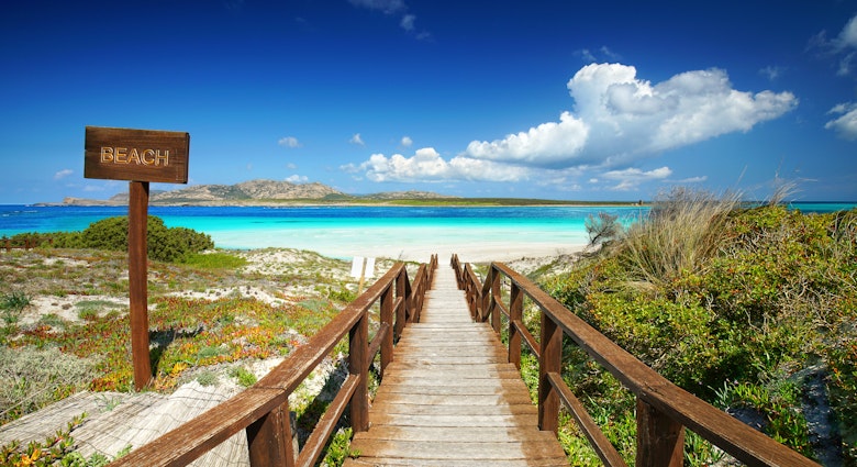 La Pelosa Stintino beach on Sardinia Island during a sunny spring day.
1067957204
archipelago, bathing, bay, beach, beachlife, blue, boardwalk, coast, coastline, destination, enjoy, exotic, footbridge, holiday, idyllic, island, italy, journey, la pelosa, landscape, lifestyle, nature, ocean, path, pathway, pine, recreation, rest, romantic, sand, sardinia, sea, seascape, seaside, sky, stairway, stintino, summer, sunny, tranquility, travel, tree, trip, tropical, turquoise, vacation, warm, water, way, wooden