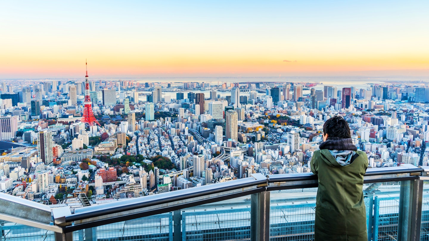 Asia Business concept for real estate and corporate construction - Tourists take shot of Tokyo Tower under bright golden sun and vivid twilight sky in Roppongi Hill, Tokyo, Japan License Type: media Download Time: 2022-01-07T13:43:08.000Z User: gwencotter Is Editorial: No purchase_order:
Adult, Building, City, Cityscape, Horizon, Male, Man, Nature, Outdoors, Person, Photography, Scenery, Sky, Urban
