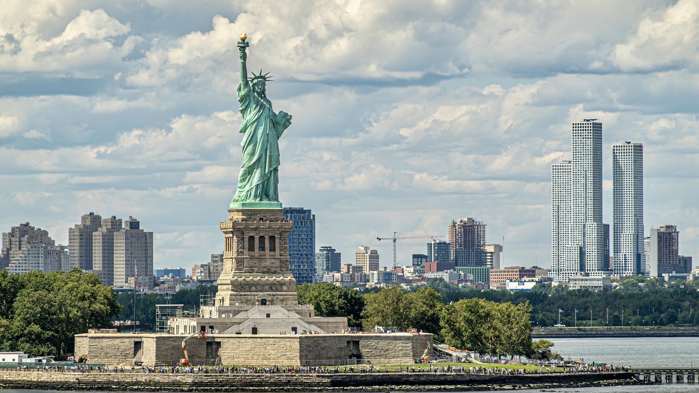 New York, NY, USA - August 1, 2023: Jouned Squared tower of Jersey city is seen to the right of Statue of Liberty on its island under blue cloudscape. Plenty of visitors and more building in back; Shutterstock ID 2464041757; purchase_order: 65050 - Digital Destinations and Articles; job: Lonely Planet Online Editorial; client: USA: visa requirements; other: Brian Healy
2464041757
america, architecture, art, bay, biggest, buildings, business, city, cityscape, cloudscape, commerce, dense, financial, fintech, journal, liberty, manhattan, markets, metropole, new jersey, new york, nyc, offices, residential, skyline, squared, statue, towers, trade, upper, usa
New York, NY, USA - August 1, 2023: Jouned Squared tower of Jersey city is seen to the right of Statue of Liberty on its island under blue cloudscape. Plenty of visitors and more building in back